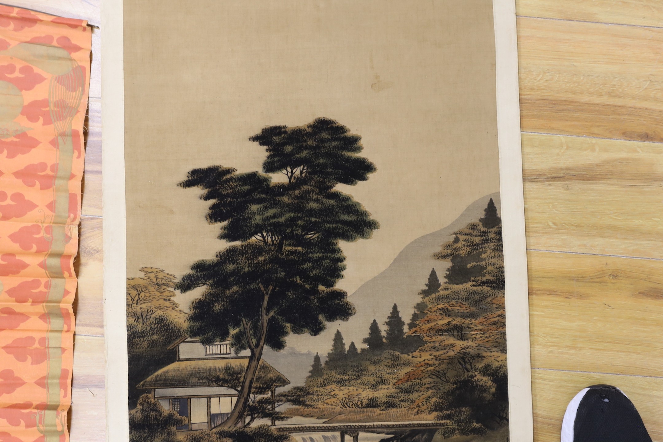 A Chinese calligraphic fabric hanging, 90 x 37cm, together with an early 20th century Japanese painted felt and watercolour landscape scroll